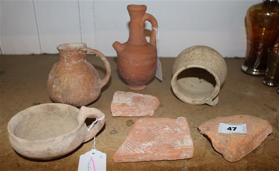 Collection of early Palestinian pottery vessels and three fragments